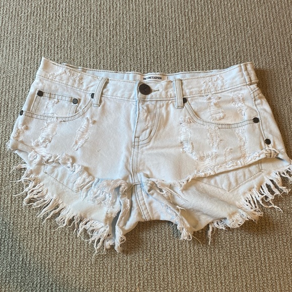 One teaspoon shorts. Low waist. Short rise. Raw curved hem - Picture 1 of 5
